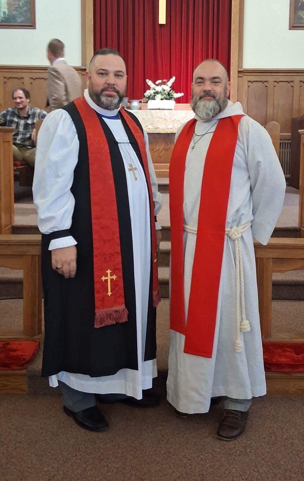 Two pastors in robes during worship
